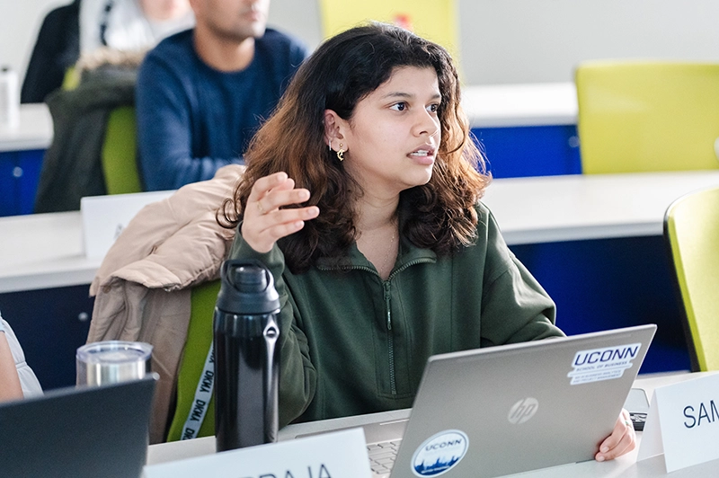 MSSRIB female student in classroom engaging in discussion.